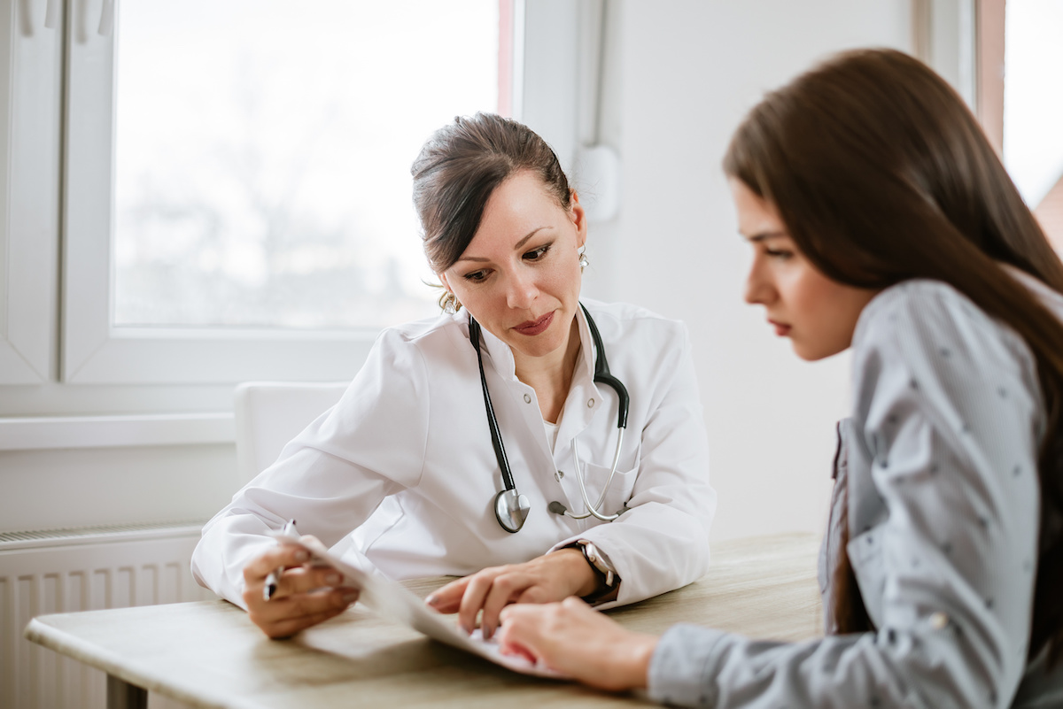 doctor and patient going over documents