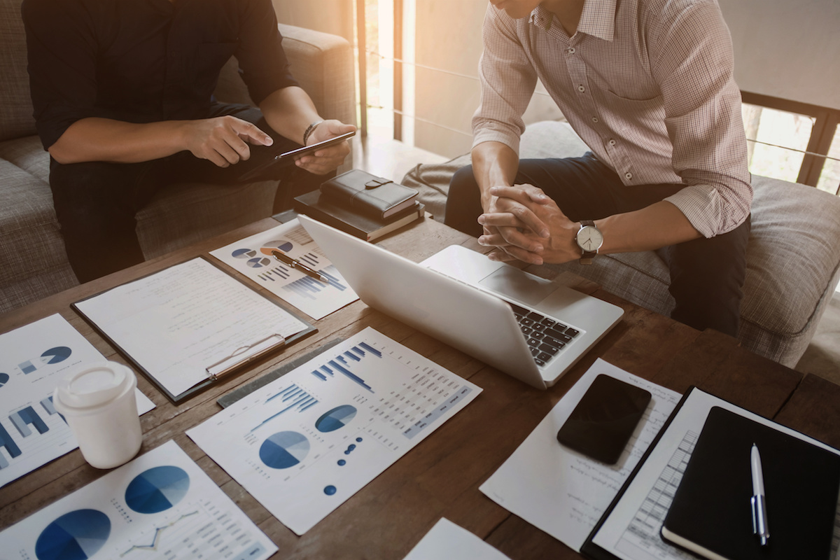 two people running a medical billing audit for a medical practice