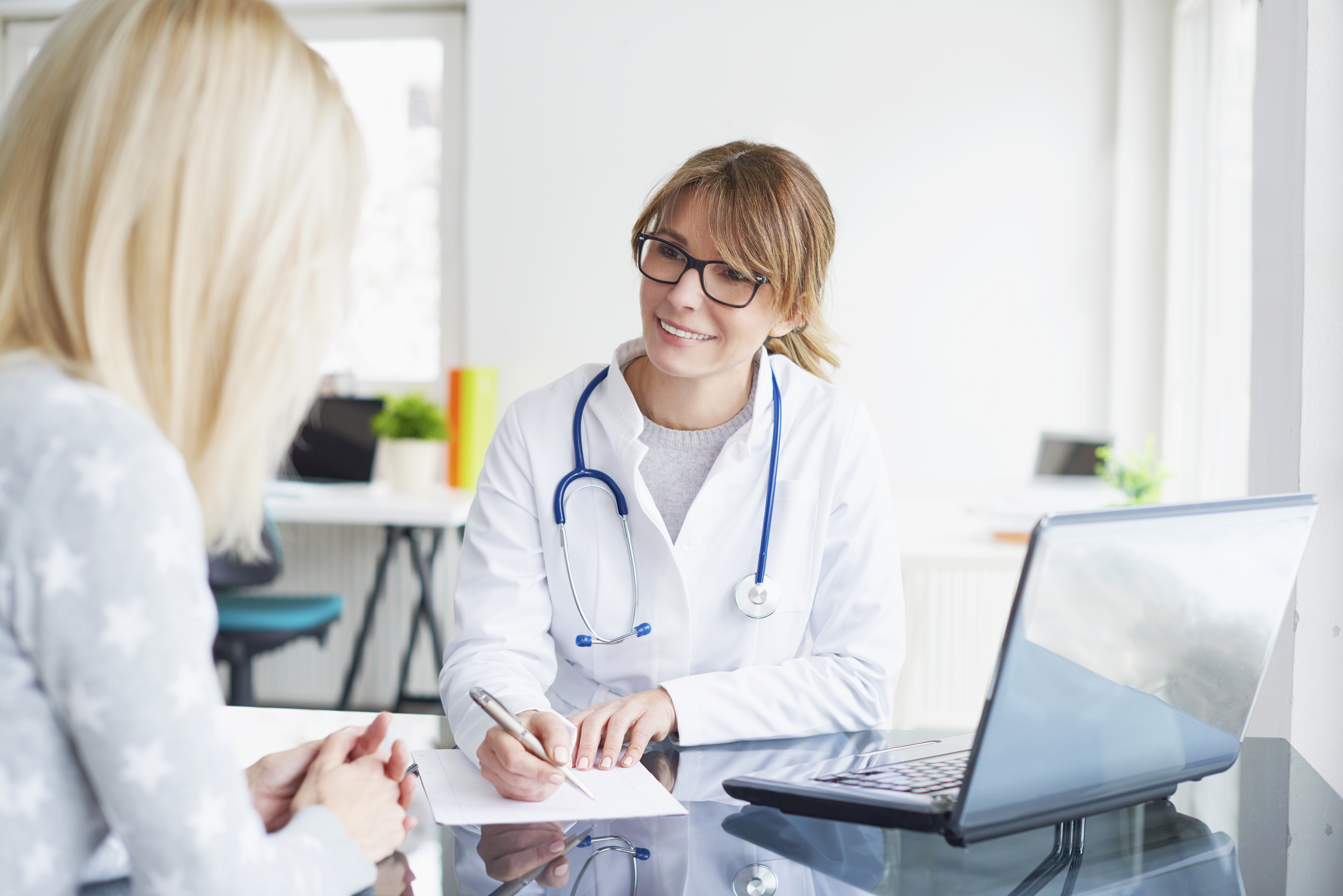 doctor meeting with a patient for a prolonged time and taking notes